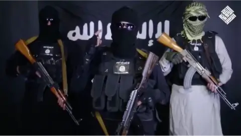 A screenshot from the IS video thought to be fake – purportedly retracting the claim of responsibility