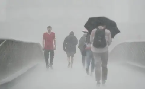 PA Media Heavy rain in London