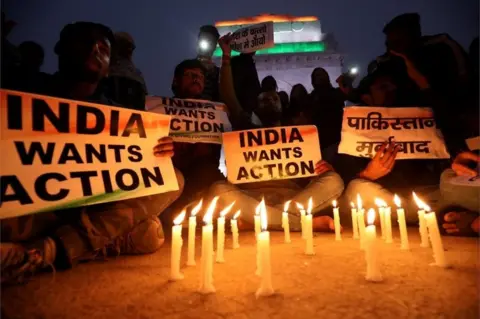 Reuters People attend a candle light vigil to pay tribute to Central Reserve Police Force (CRPF) personnel who were killed after a suicide bomber rammed a car into the bus carrying them in south Kashmir on Thursday,
