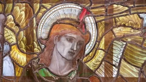 Finnbarr Webster A close up of one of the heads of the Angeli Ministrantes