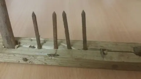 Dyfed Powys Police A picture of a plank with nails