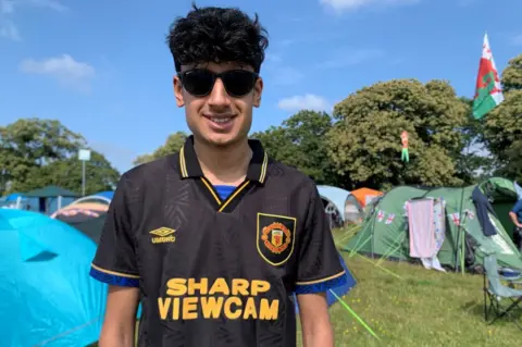 Shaan Sagoo in a Manchester United shirt at Latitude