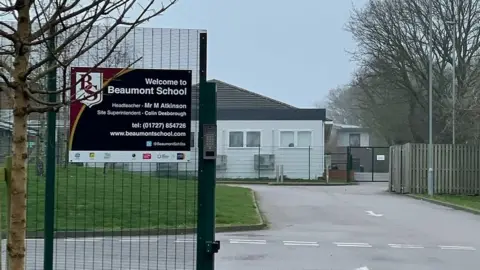 Joey Kwong Beaumont School gates from outside