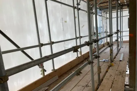 Kate Scotter/BBC A general view of the plastic wrapping from the inside of St Francis Tower, Ipswich