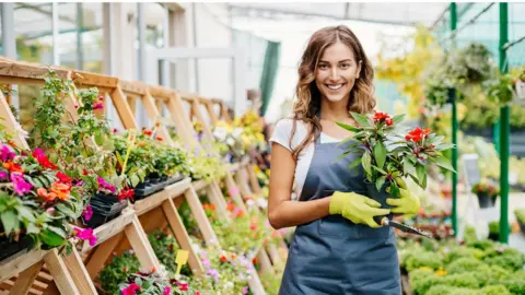 Getty Images Employee in garden centre