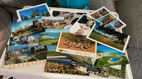 Family handout Postcards on a table