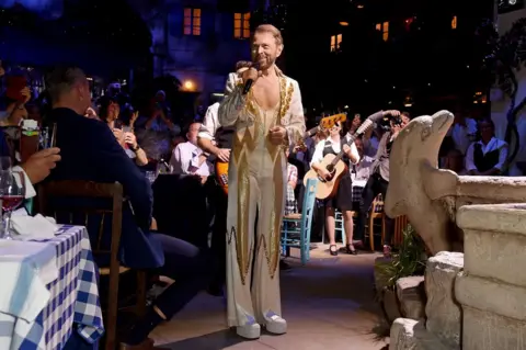 David M. Benett/Getty Bjorn Ulvaeus makes a cameo in his original Abba costume from 1977 at the opening night of MAMMA MIA! The Party at The O2 in London on 19 September 2019.