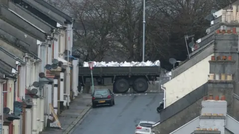 Matt Keeble/PA Wire Bomb disposal experts transport the device