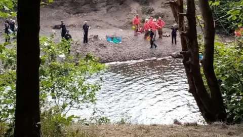 BBC Police at the edge of the river