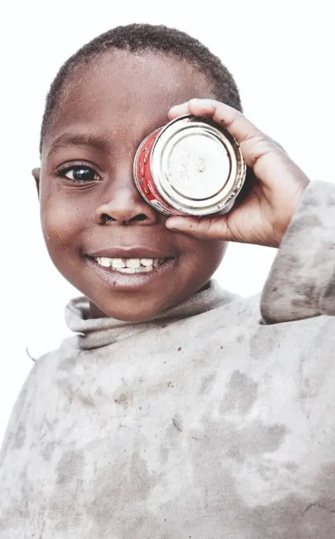 Rankin In 2008 and 2009, Oxfam worked with celebrity photographer Rankin on a photo project in the war-torn eastern provinces of the Democratic Republic of Congo. The result is a book of images, "We are Congo," that reveals the humanity of people caught in a brutal war and the devastating disease and malnutrition it has spawned.