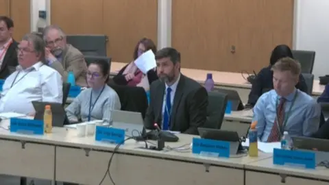 South Gloucestershire Council Council leader Cllr Toby Savage (second from right) next to Cllr Erica Williams at full council on Wednesday, February 15