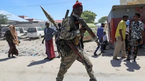 Reuters Somali military officer supporting opposition leaders walks along streets of Yaqshid district of Mogadishu, Somalia April 25, 2021