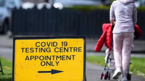 Getty Images A sign to a testing centre