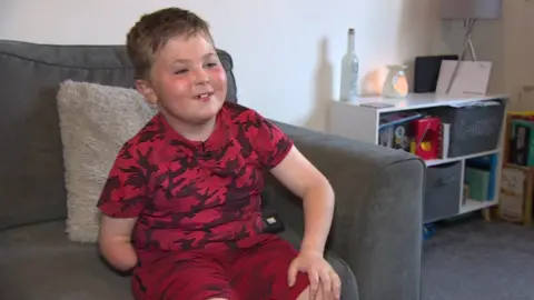 BBC Alex, 7, who is getting a bionic arm after a plumber donated £12k