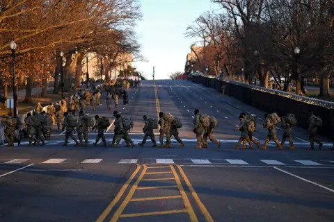 Reuters Troops prepare to exit the Capitol after the inauguration of Joe Biden as the 46th President of the United States, in Washington DC, 20 January 2021.