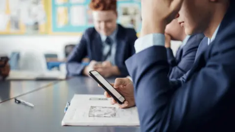 Getty Images Schoolgirl with phone