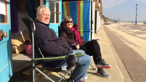 Pat and Donald Tryhorn at the beach hut they rent during the winter