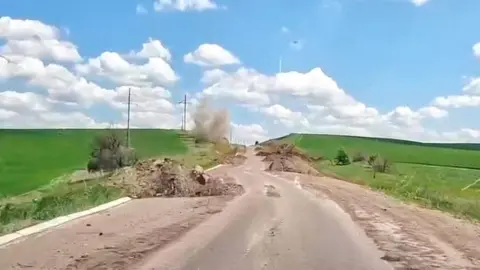 Serhiy Haidai/Luhansk OVA Mr Haidai published a picture of the road indicating damage to the road, which he said was still open
