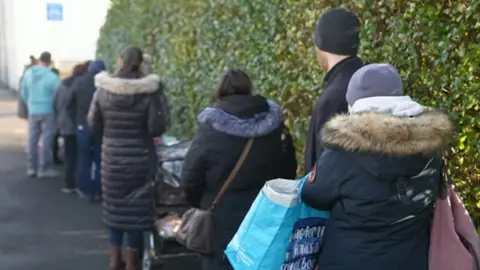 BBC Families queue for food pantry