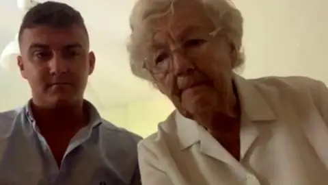 BBC Thomas Cook passenger Mary Nicholls, (right) with her grandson, Matt Walker