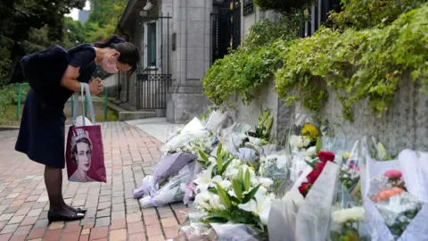 Photo by FRANCK ROBICHON/EPA-EFE/REX/Shutterstock Image shows mourner in Tokyo, Japan