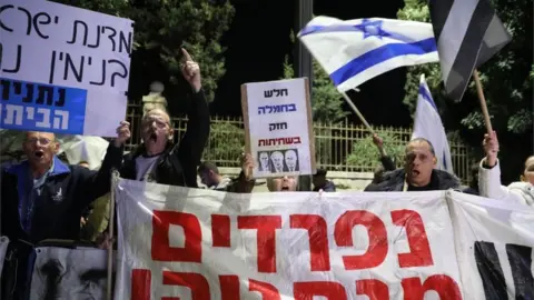 EPA Protesters against Mr Netanyahu outside the prime minister's residence in Israel