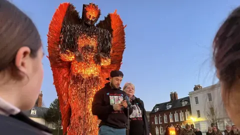 Danny and Viv next to Knife Angel