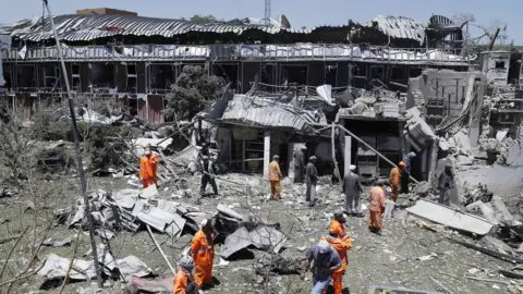 EPA Workers remove debris from a damaged area a day after a suicide bomb attack near foreign embassies in Kabul, Afghanistan, 01 June 2017