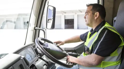 Getty Images Lorry driver leaving a warehouse