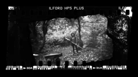 Derek Man Woman in an orchard