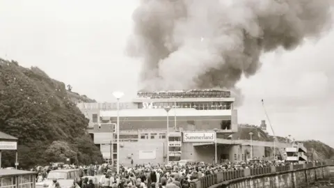 MANX NATIONAL HERITAGE Smoke rising from Summerland complex