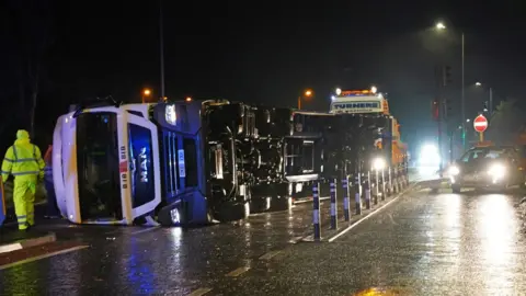 PA Media A lorry blown over in high winds blocks the A179 near Hartlepool