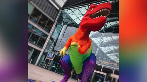 Break Dinosaur sculpture in Pride colours