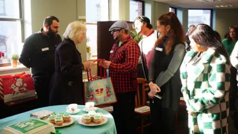 PA Media The Queen greeting staff at Emmaus Bristol