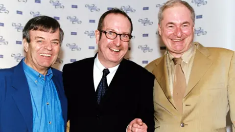 PA Media File photo dated 18/03/02 of Radio DJ's Tony Blackburn (left), Steve Wright and Paul Gambaccini during the Sony Radio Awards launch party at the Commonwealth Club in London.