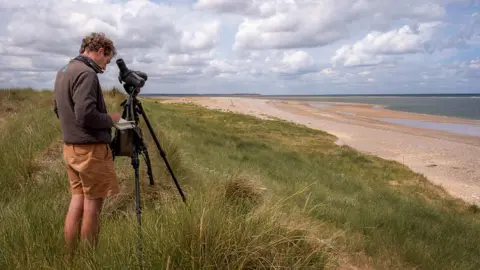 Hanne Siebers National Trust Ranger Duncan Halpin monitoring seabirds on Blakeney Point