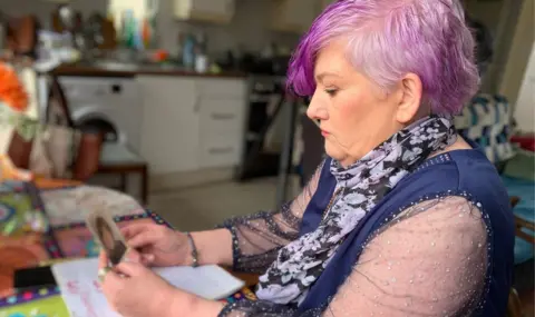 Sinead Buckley looking a childhood photo