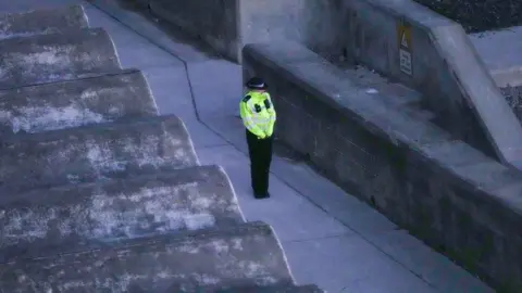 Eddie Mitchell A policewoman at the undercliff in Ovingdean