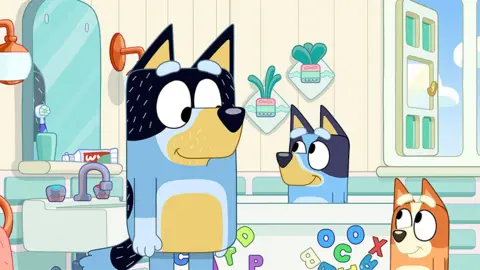Ludo Studio/BBC Studios Bluey and family in bathroom