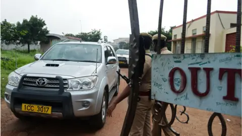 Getty Images Vehicles carrying British anti-piracy crew members leave prison in Chennai