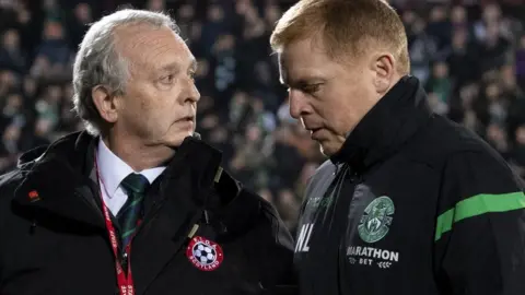 SNS Group Hibernian manager Neil Lennon walks off the Tynecastle pitch at full time