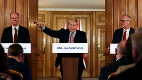 Getty Images Boris Johnson, Sir Patrick Vallance and Chris Whitty