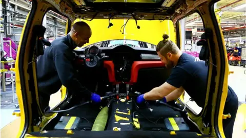 Getty Images Workers at a UK car factory