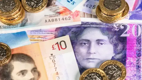 Getty Images Scottish banknotes and coins