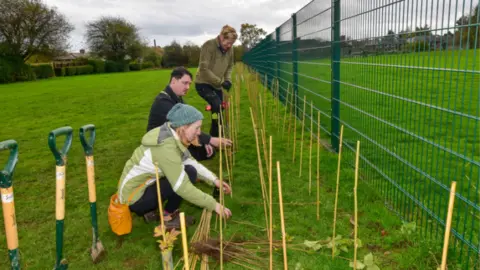 Oswestry Town Council People planting trees in Oswestry
