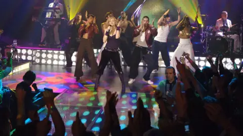 KMazur/Getty Madonna performing at Koko