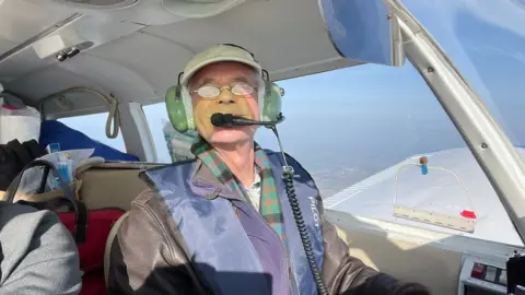 BBC Dick Beath flying the plane to Poland