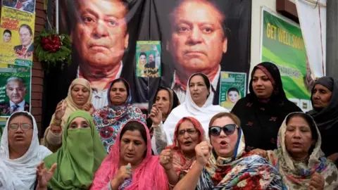 AFP Supporters pray outside a hospital where Sharif was being treated in October