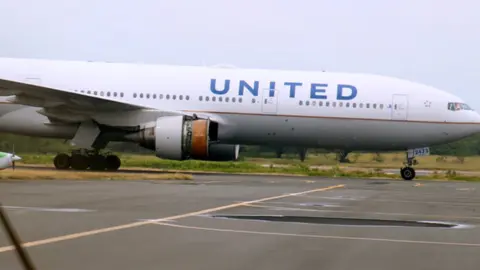 Pete Hughes United Airlines flight N773 at Honolulu International Airport, Hawaii, after losing engine cowling during flight - 13 February 2018