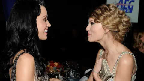 Getty Images Katy Perry and Taylor Swift talking to each other